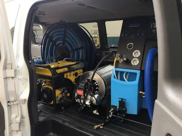 Truck-mounted extraction unit and hose reel loaded for a Naples water call