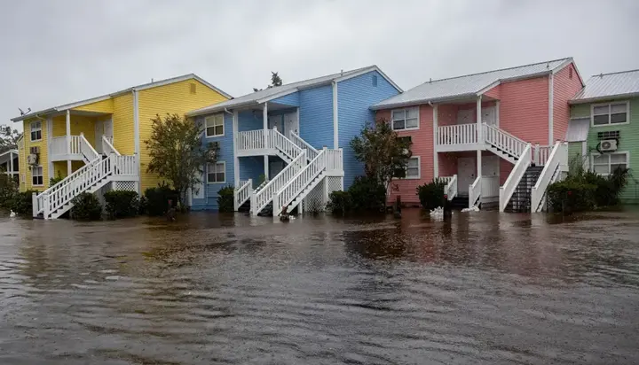 Coastal townhomes standing in storm floodwater on the Gulf coast